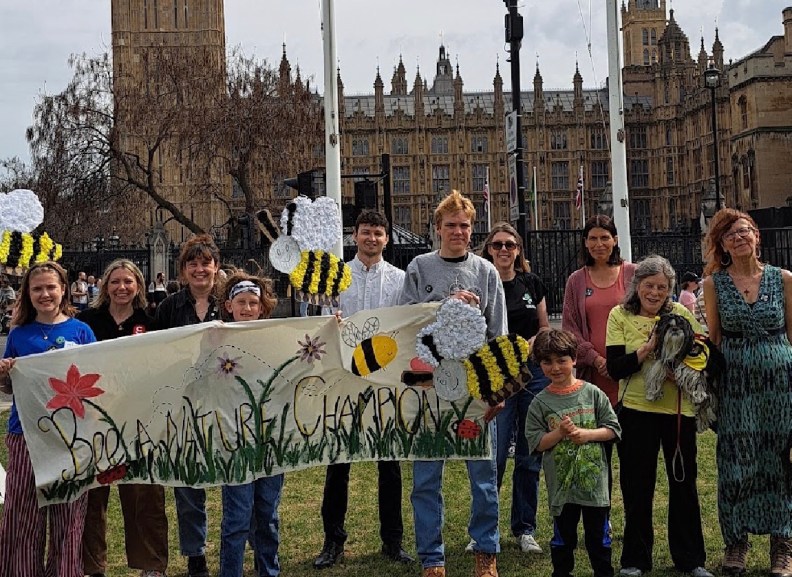Children Buzz to Parliament with Bee Postcards to Demand a Law to Protect Nature and Climate
